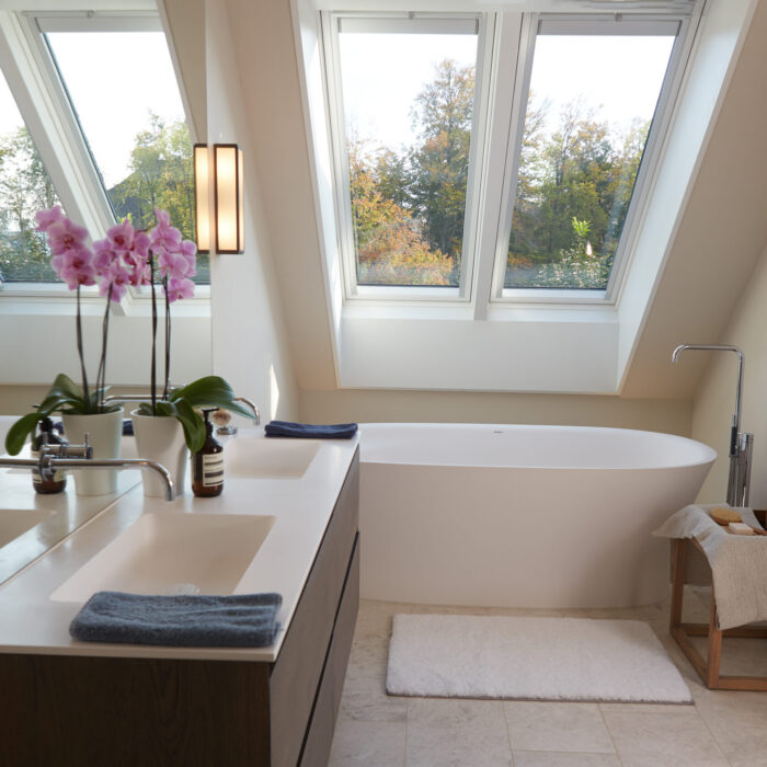 Smoked oak bathroom vanity by Jacober Interiors