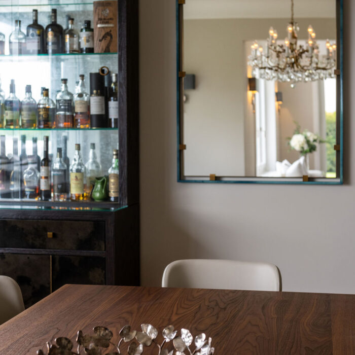 Dining room with bespoke drinks cabinets designed by Jacober Interiors